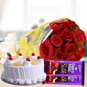 Half Kg Pineapple Cake with 6 Red Roses Bunch and 2 Cadbury Silk Chocolates